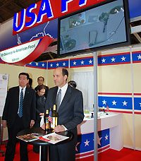 Ambassador Roos in front of the USA Pavilion at FOODEX JAPAN 2011